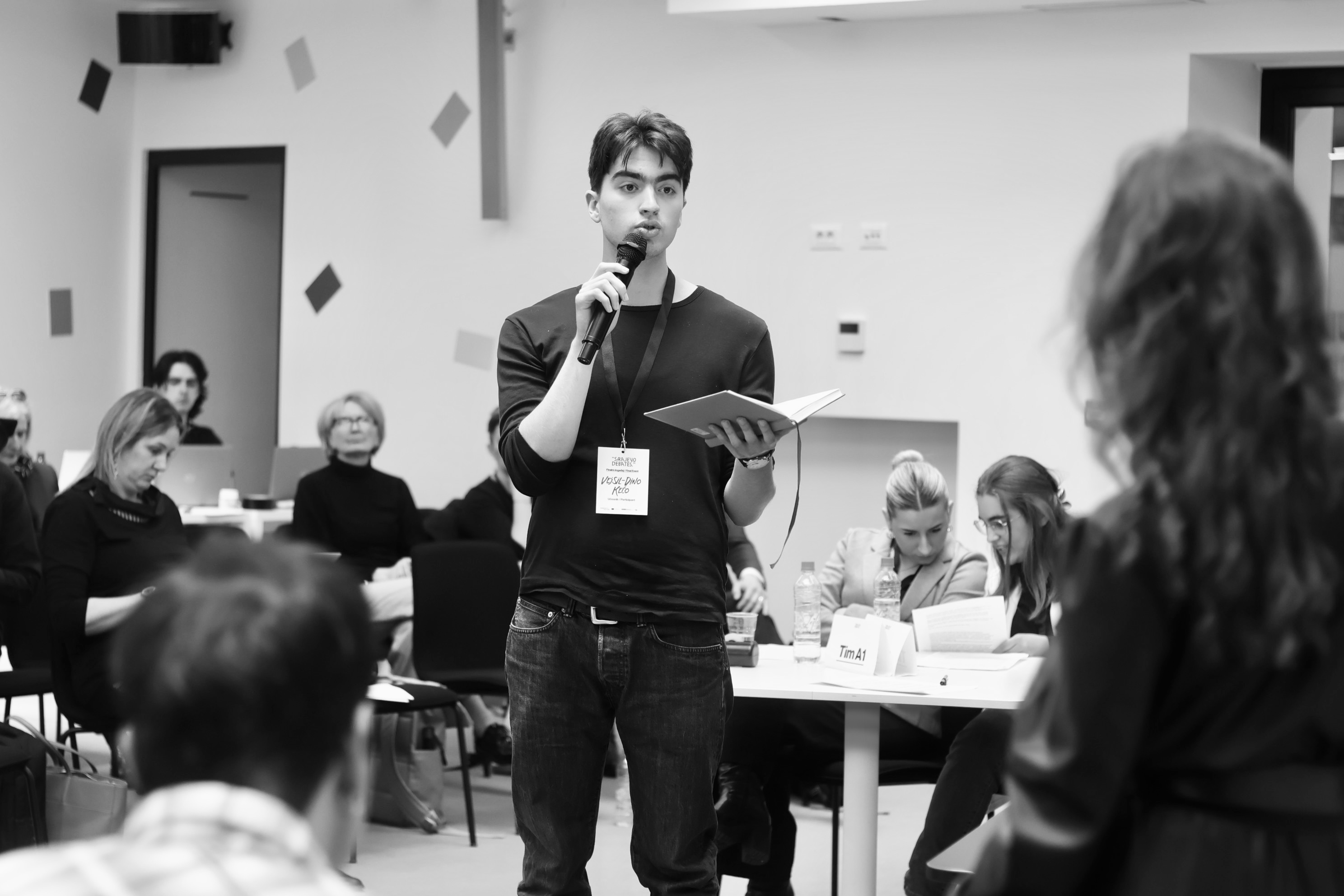 Participant speaking during a debate session